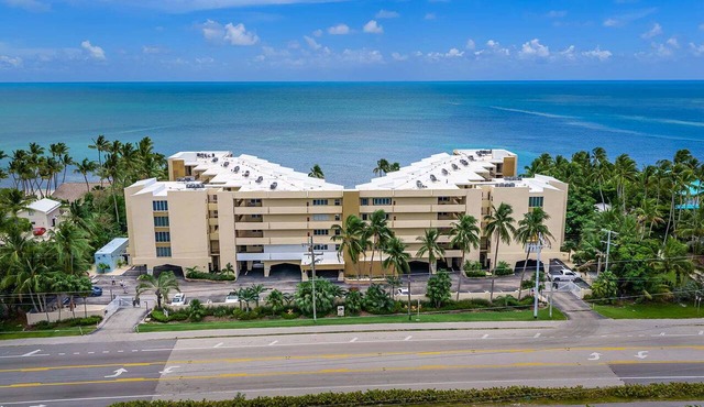 2BR Islamorada condo with pool, gym, balcony, and full kitchen.