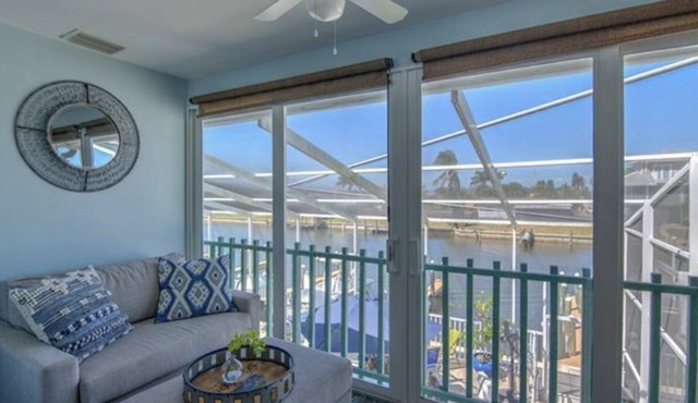 Beautiful SJC Island Condo w/heated pool on main canal, great fishing!