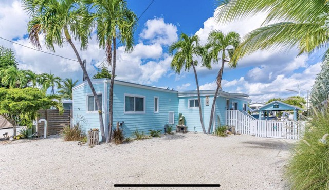 Canal Front with Bay Access Home and private sandy beach.