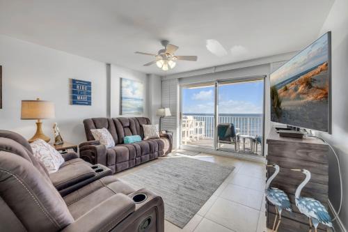 Direct oceanfront 2/2 condo with large private balcony, heated pool, and garage parking in Ormond Beach
