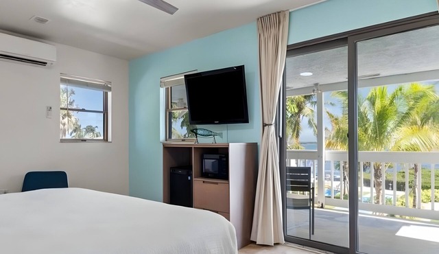 Island Retreat w/Private Patio & Marina Views | Breakfast Included