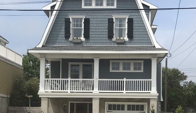 Just listed. Steps to beach. 40 min ferry to NYC. Partial ocean views from home.