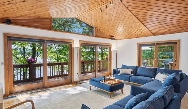 Lakefront Seneca Lake retreat with a private beach, dock, hot tub, and game room. Minutes from wineries and Watkins Glen. Pet friendly.