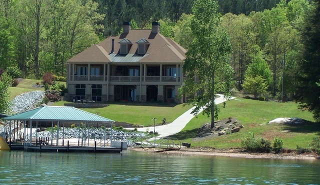 Luxury Lake Front Home featuring beautiful Mountain and Lake veiws