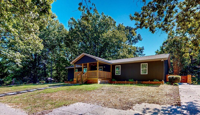 Renovated home with covered deck, fireplace, & all-new interior