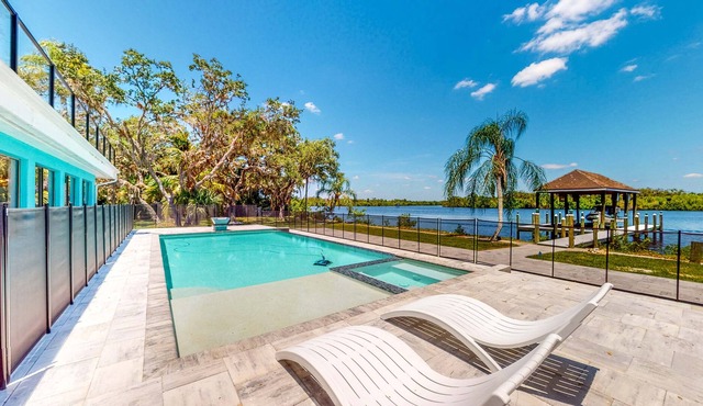 Riverfront home - pool, pool spa, dock, & bikes