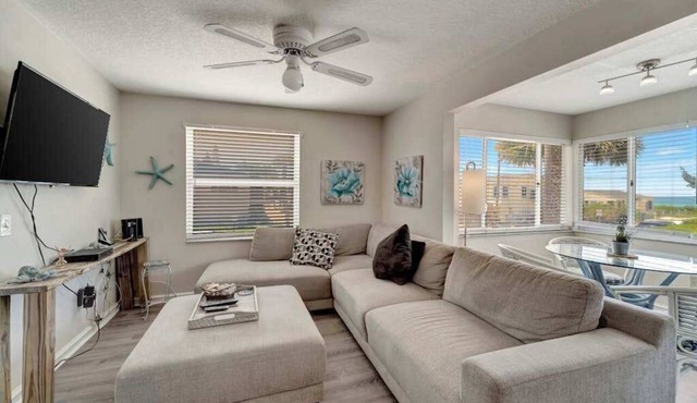 Serene oceanfront suite with Gulf view, grill, patio, central AC, & WD
