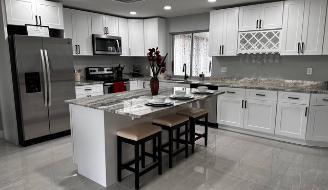 TOTALLY RENOVATED beautiful Pool home in Yacht Club on a Canal- Bring your boat!