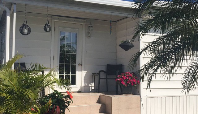 Vacation Home- Beautiful Immaculate. Close to beach & airport. Gated community.
