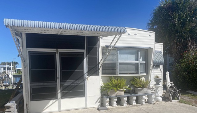 Vintage cozy beach house waterfront on grand canal with dock