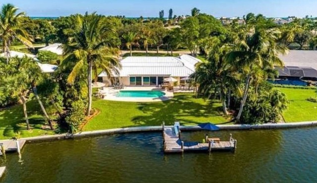 Waterfront 4 bdrm home w/pool, dock and beach access.