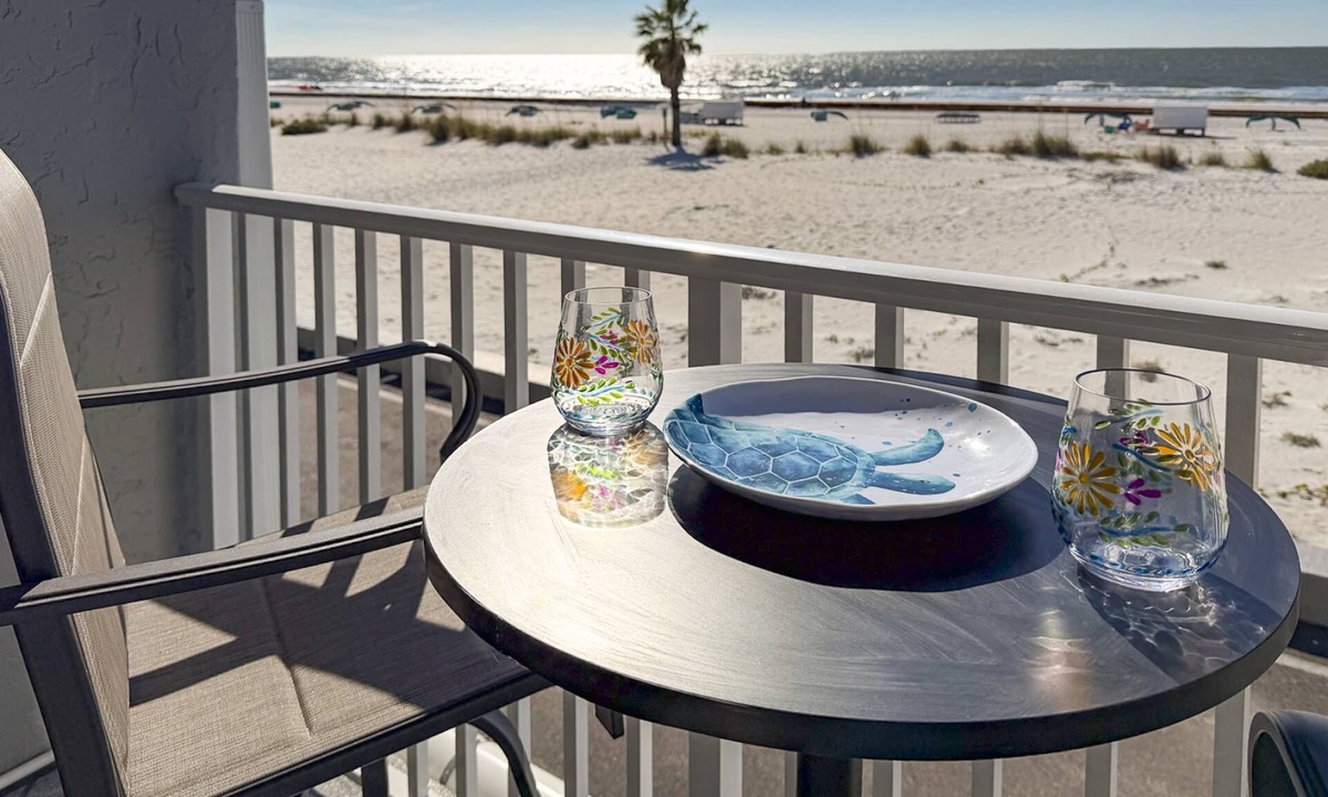Treasure Island Condo | Beachfront Balcony ~ View of Treasure Island Beach ~ Heated Pool, Tiki Bar, BBQ Grills, Volleyball.