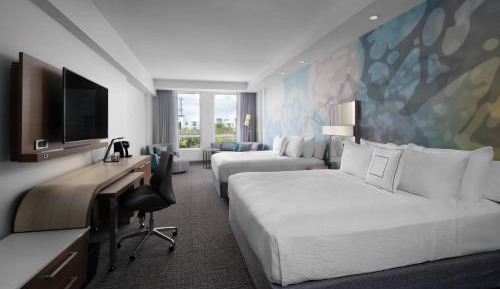 Room with Two King Beds and Sofa Bed