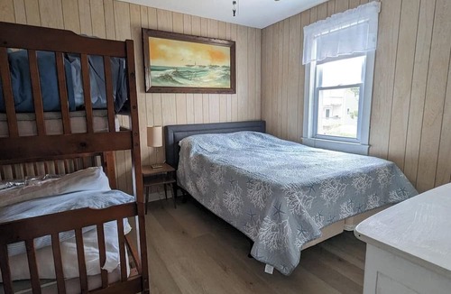North Beach Haven Apartment | 3 cozy bedrooms, sleeping a total of 6 guests Partial water views of the beautiful bay Large deck and grassy yard for outdoor enjoyment