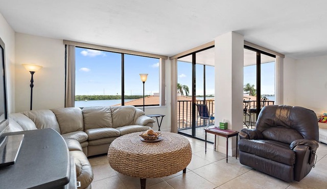 Beautiful updated 3rd floor condo with open floor plan and lovely water views